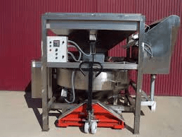 Instrumento de pesaje de funcionamiento automático que determina la masa de un producto a granel dividiéndolo en cargas discretas.